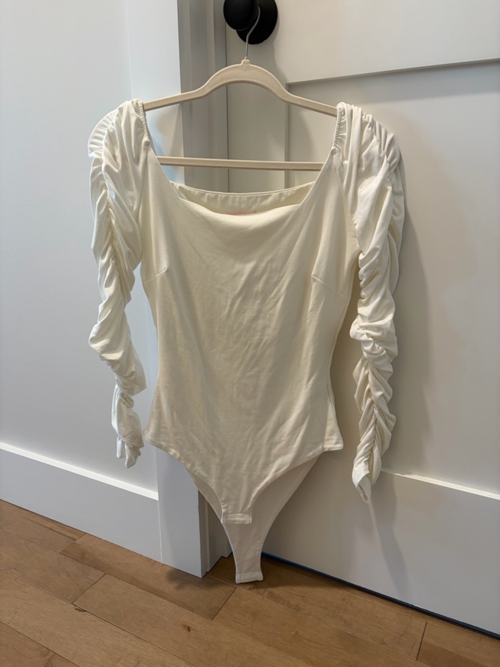 Pink Lily Cream Off-Shoulder Bodysuit
